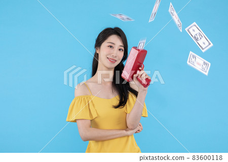 shopping event concept, beautiful Korean Asian woman with money coupon gun shopping event concept, beautiful Korean Asian woman with money coupon gun 83600118