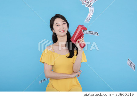 shopping event concept, beautiful Korean Asian woman with money coupon gun shopping event concept, beautiful Korean Asian woman with money coupon gun 83600119