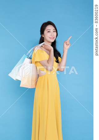 shopping event concept, beautiful Korean Asian woman with shopping bag shopping event concept, beautiful Korean Asian woman with shopping bag 83600219