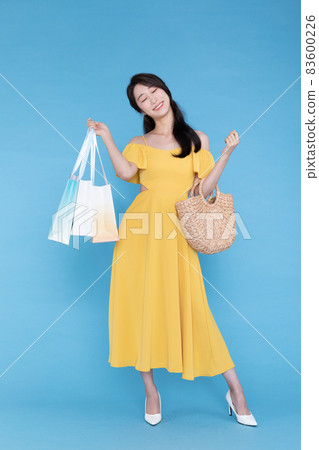 shopping event concept, beautiful Korean Asian woman with shopping bag and bag shopping event concept, beautiful Korean Asian woman with shopping bag and bag 83600226