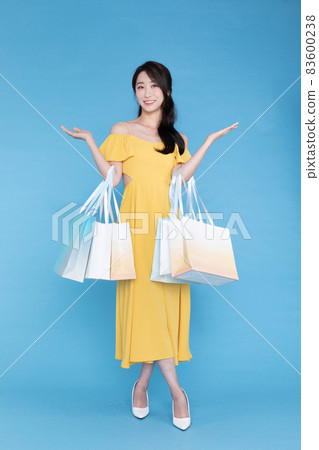 shopping event concept, beautiful Korean Asian woman with shopping bag shopping event concept, beautiful Korean Asian woman with shopping bag 83600238