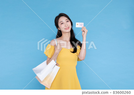 shopping event concept, beautiful Korean Asian woman with shopping bag and credit card shopping event concept, beautiful Korean Asian woman with shopping bag and credit card 83600260