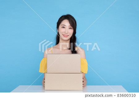shopping event concept, surprised Korean Asian woman showing delivery box shopping event concept, surprised Korean Asian woman showing delivery box 83600310
