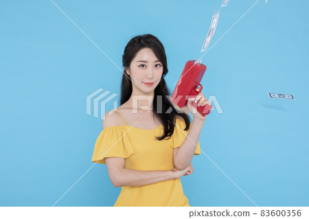 shopping event concept, beautiful Korean Asian woman with money coupon gun shopping event concept, beautiful Korean Asian woman with money coupon gun 83600356