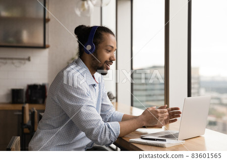 Happy millennial african american businessman holding video call. Happy millennial african american businessman holding video call. 83601565