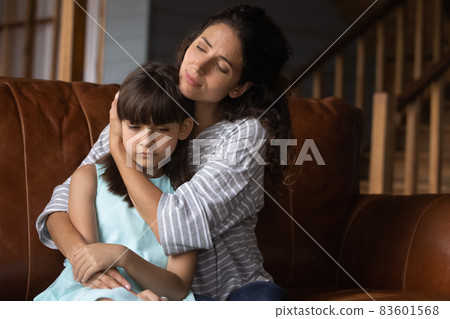 Worried mother hugging sad offended kid, consoling girl Worried mother hugging sad offended kid, consoling girl 83601568