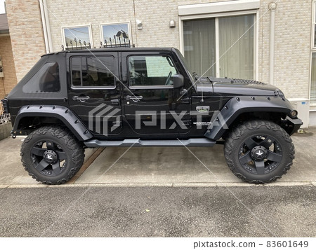 It is a black jeep. 83601649