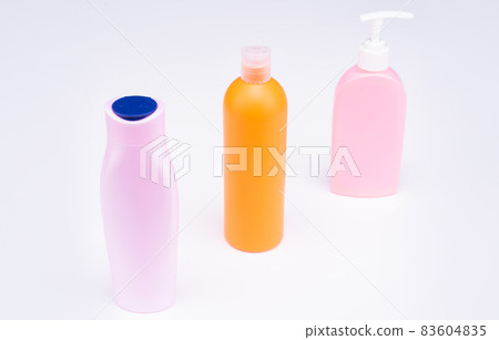 Multicolor plastic refillable liquid toiletry product containers in row, bottles Multicolor plastic refillable liquid toiletry product containers in row, bottles 83604835