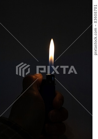 Bright fire lighters in the dark closeup 83608701