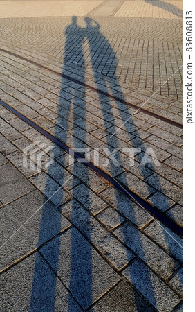 Shadow of men on the floor in the evening. Shadow of men on the floor in the evening. 83608813