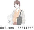 A business woman with a bag on her shoulder and holding documents 83611567