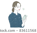 A woman in trouble while looking at her smartphone 83611568