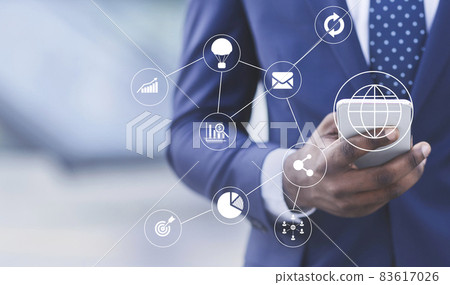 Successful millennial african american man in suit checks financial application on smartphone, collage with digital icon Successful millennial african american man in suit checks financial application on smartphone, collage with digital icon 83617026