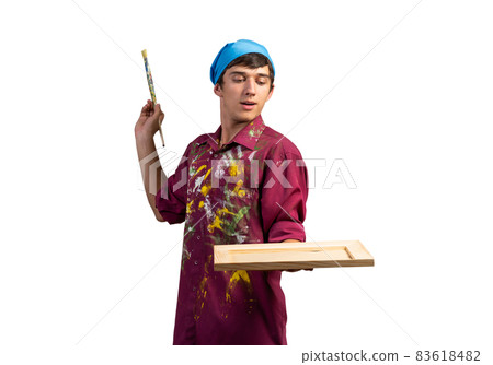 Young handsome painter artist holding paintbrush 83618482