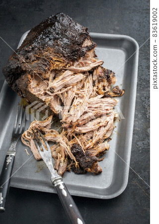 barbecue pulled pork piece of Boston butt torn to bits  83619002