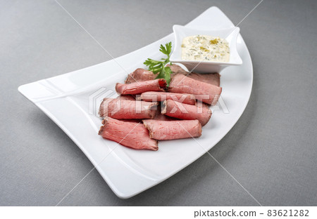 Traditional lunch meat with sliced cold cuts roast beef and remoulade Traditional lunch meat with sliced cold cuts roast beef and remoulade 83621282