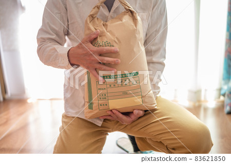 Senior man with brown rice 83621850