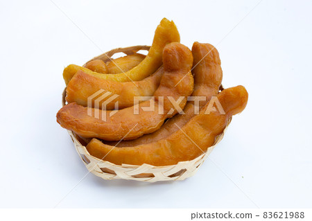 Tamarind pickled fermented in bamboo basket on white background. Tamarind pickled fermented in bamboo basket on white background. 83621988