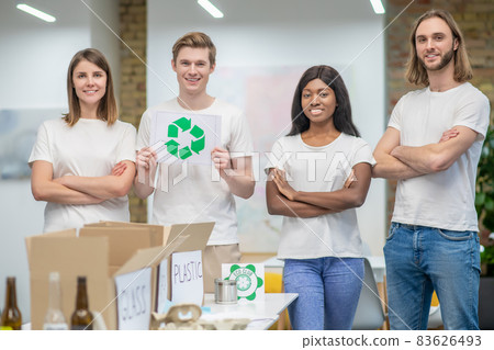 Young ecologists working in a recycling center Young ecologists working in a recycling center 83626493