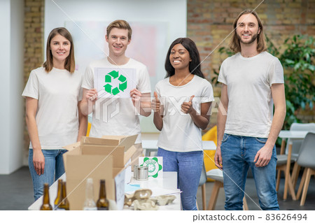 Young ecologists working in a recycling center Young ecologists working in a recycling center 83626494