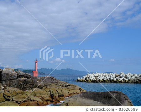Red lighthouse at Tomonoura fishing port in Shishikui, Tokushima 83626589