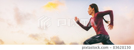 Run fast woman athlete sprinting profile on sky banner panorama background. Runner running starting race. 83628130