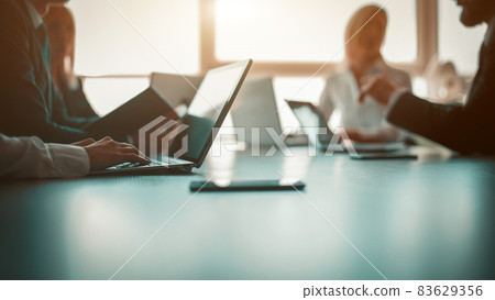 Link build developers testing usability of a new program or website with different operation system laptops in the modern office. Business partners are planning a new startup in the office 83629356