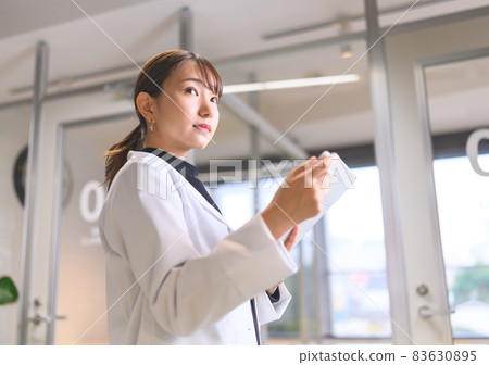 A lady in white 83630895