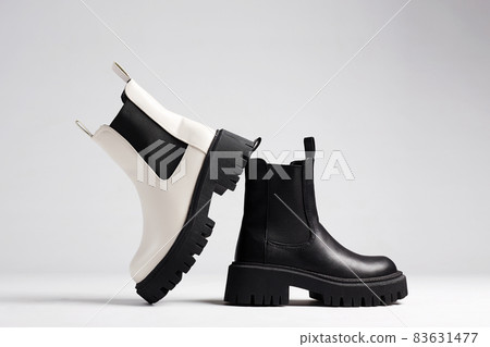 black and white boots. fashion shoes still life 83631477