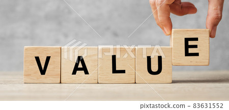 Business man hand holding wooden cube block with Value business word on table background. Mission, Vision and core values concept Business man hand holding wooden cube block with Value business word on table background. Mission, Vision and core values concept 83631552