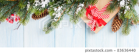 Christmas background with fir tree and gift Christmas background with fir tree and gift 83636440