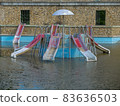 A swimming pool that has been abandoned for a long time due to the coronavirus pandemic.  83636503