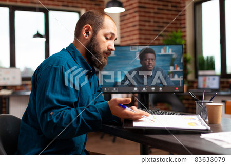 Executive manager explaining management strategy to remote workmate during online videocall 83638079