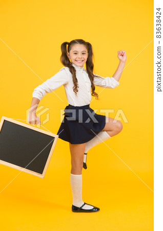 Follow me. Schoolgirl pupil informing. School girl hold 83638424
