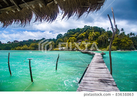 Wooden beach bar in sea and hut on pier in koh Mak island, Trat, Thailand Wooden beach bar in sea and hut on pier in koh Mak island, Trat, Thailand 83638863