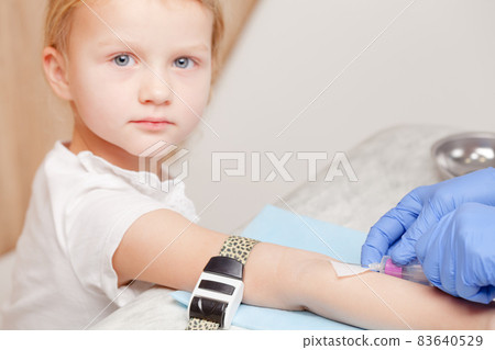 Nurse takes a blood sample from little girls arm - pediatric venipuncture procedure Nurse takes a blood sample from little girls arm - pediatric venipuncture procedure 83640529