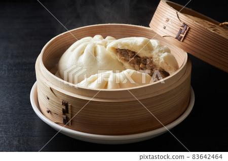 Hot meat bun steamed in a steamer Hot meat bun steamed in a steamer 83642464