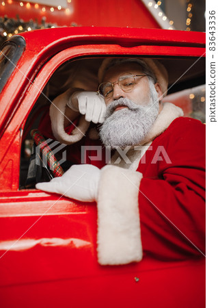 Santa Claus is preparing for Christmas. Portrait of Santa Claus driving Santa Claus is preparing for Christmas. Portrait of Santa Claus driving 83643336