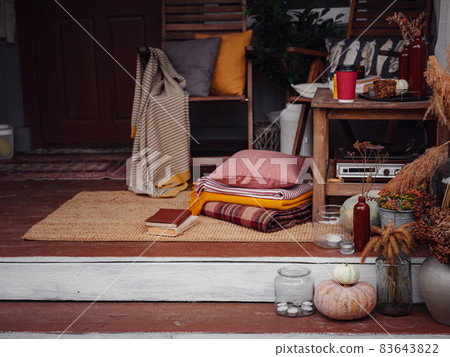 porch or patio, family heirlooms, with pumpkins and cozy blankets 83643822