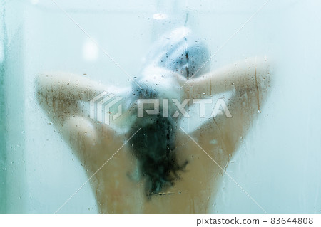 Woman enjoy taking a shower and bath. Woman enjoy taking a shower and bath. 83644808