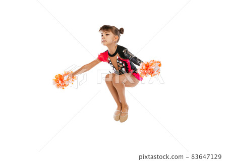 Full-length portrait of girl, child training cheerleadin, jumping isolated over white background 83647129