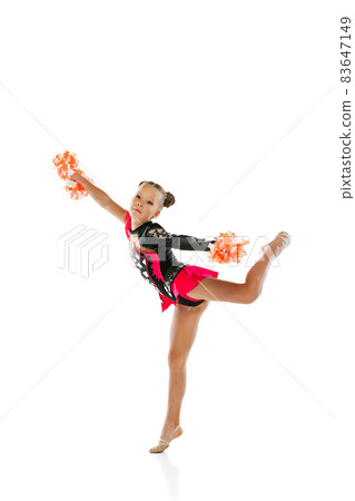 Full-length portrait of girl, child training cheerleading isolated over white background Full-length portrait of girl, child training cheerleading isolated over white background 83647149
