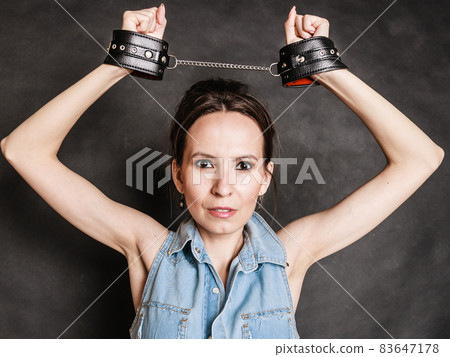 Arrest and jail. Criminal woman prisoner girl in handcuffs Arrest and jail. Criminal woman prisoner girl in handcuffs 83647178