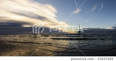 Sunset on Crosby Beach in winter, Crosby, Liverpool, United Kingdom Sunset on Crosby Beach in winter, Crosby, Liverpool, United Kingdom 83647894