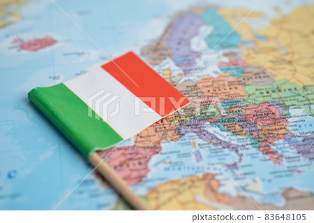 Bangkok, Thailand - February 7, 2021 Italy flag on world map background. Bangkok, Thailand - February 7, 2021 Italy flag on world map background. 83648105