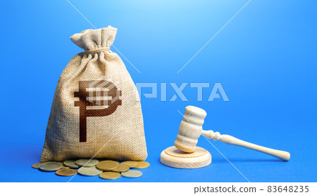 Philippine peso money bag and judge's gavel. Litigation, dispute resolution, conflict of interest settlement. Justice. Lawyer services. Protection of rights. Awarding moral financial compensation. 83648235
