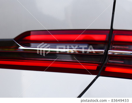 Rear LED headlamp of a modern car. Brake taillight. Rear LED headlamp of a modern car. Brake taillight. 83649433