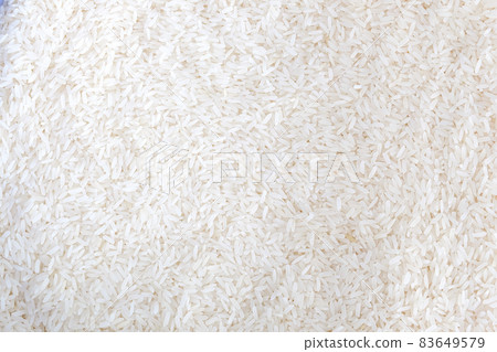 Close up of grains of jasmine rice on background. 83649579