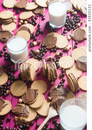 breakfast with chocolate cookies and a glass of milk breakfast with chocolate cookies and a glass of milk 83650132