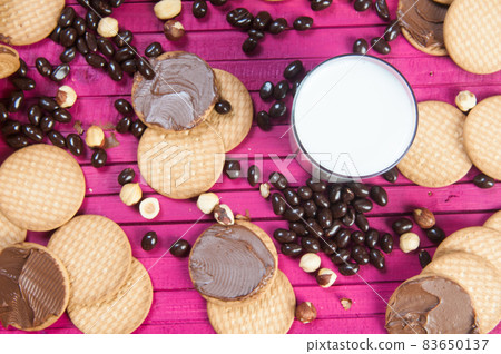breakfast with chocolate cookies and a glass of milk breakfast with chocolate cookies and a glass of milk 83650137